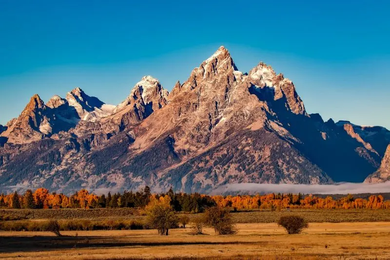 Natural landscape containing Mountain, Sky, Tree and Terrain