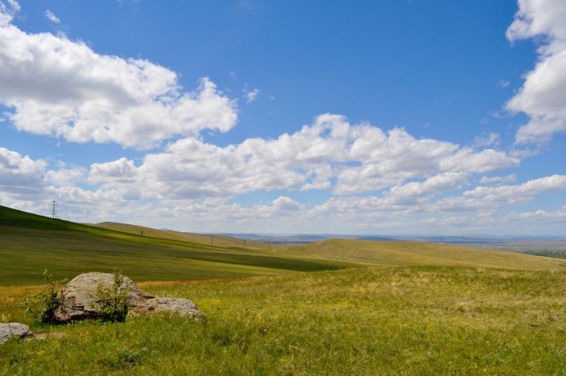 Open land under a blue sky