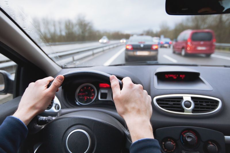 A Person Driving Carefully in Traffic