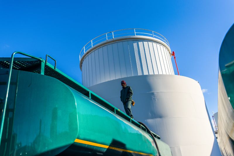 Worker on Top of a Biofuels Plant