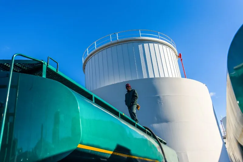 16 Important Pros and Cons of Biofuels to Know 6 Worker on Top of a Biofuels Plant