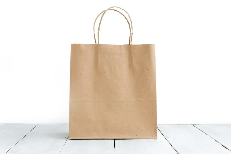 Paper bag on the wooden table