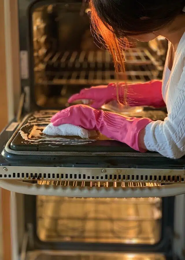 Are Double Ovens More Energy Efficient? 2 Woman Cleaning a Double Oven