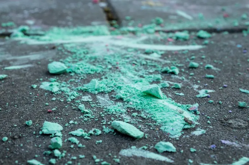 green chalk on sidewalk