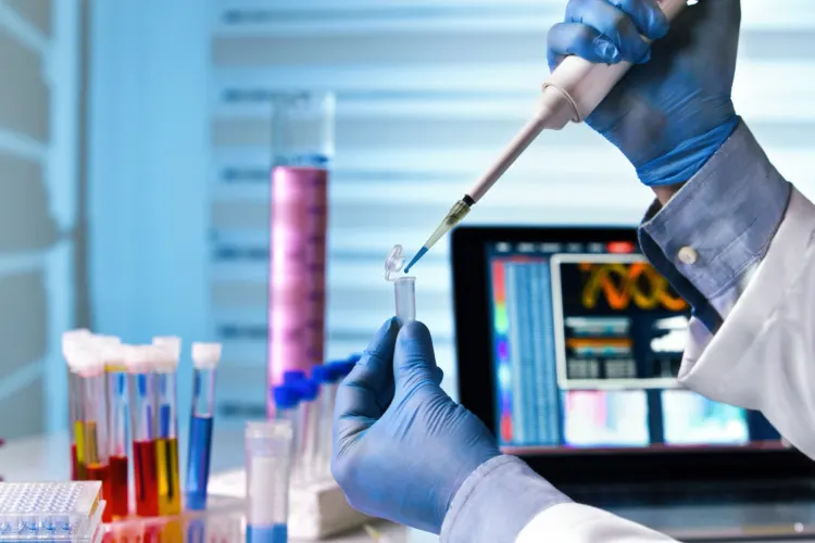 20 Important Genetic Engineering Pros and Cons to Know 9 Hands of engineer genetic working in laboratory