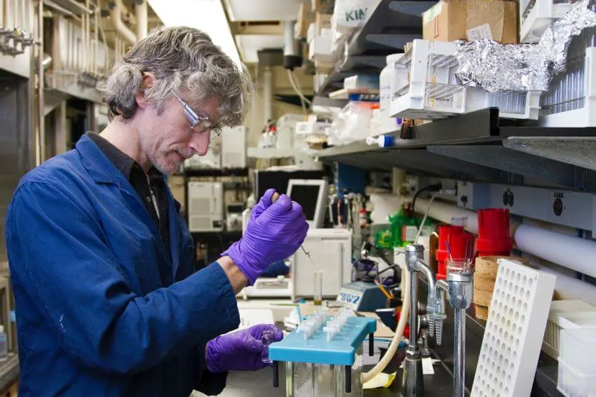 Scientist Transferring Fluids on a Vials