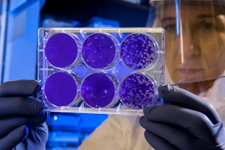 Woman holding a Petri Dish