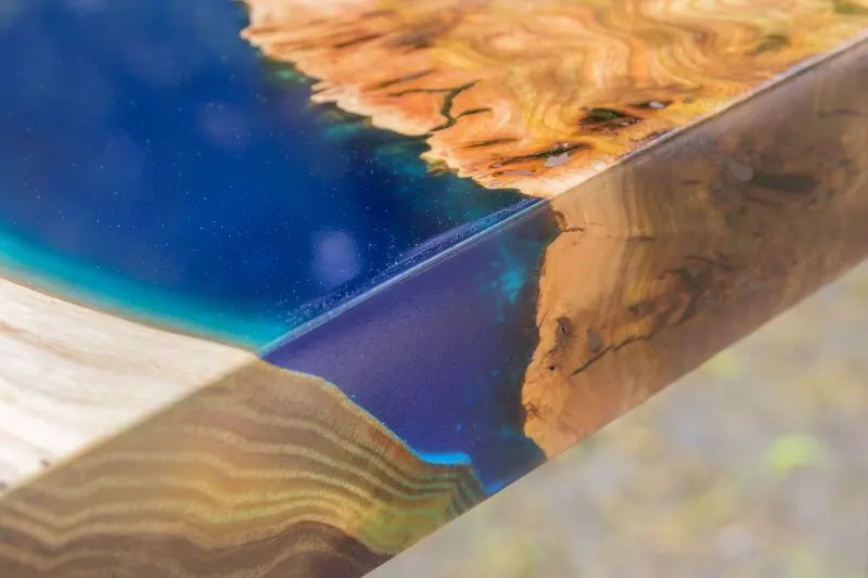 Is Epoxy Resin Bad for the Environment? 6 wooden table made of elm slab with epoxy resin filling