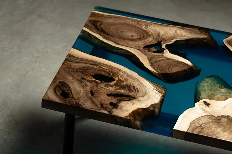 The table is covered with epoxy resin and Luxury quality wood