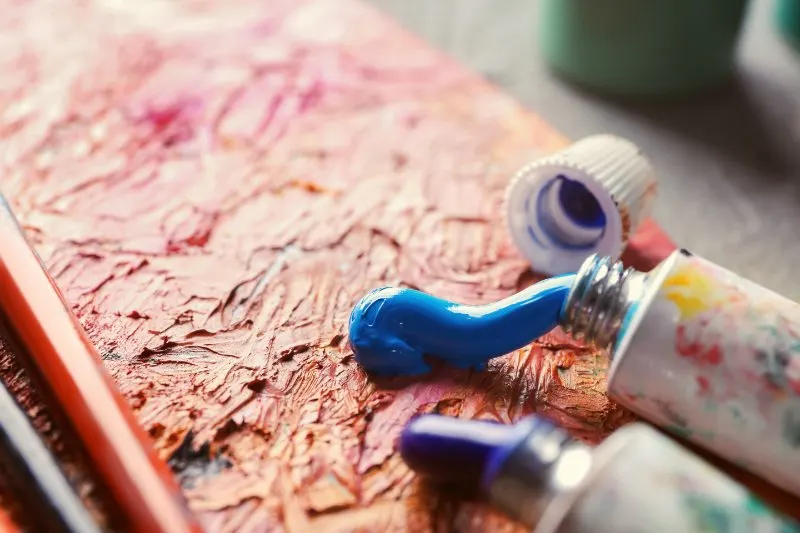 Close up of Tubes with paints on table