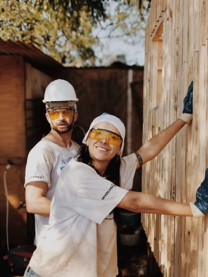 Man and Woman Building a Shed