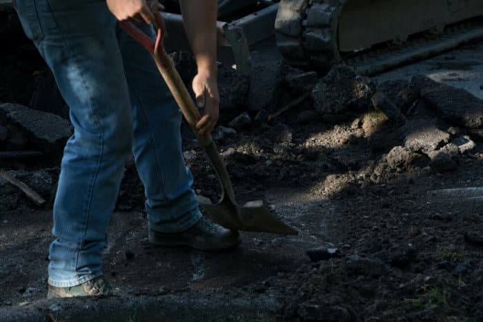 Man Holding Shovel