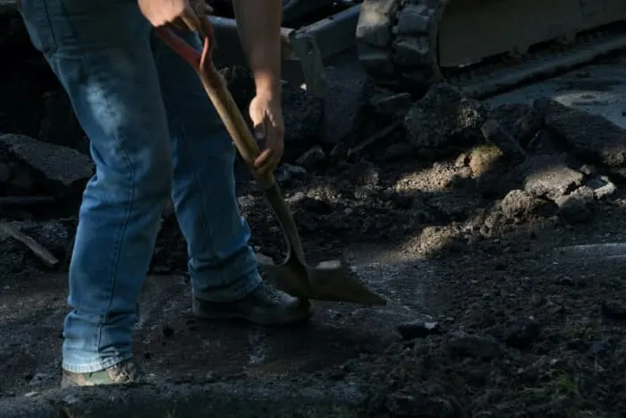 Man Holding Shovel