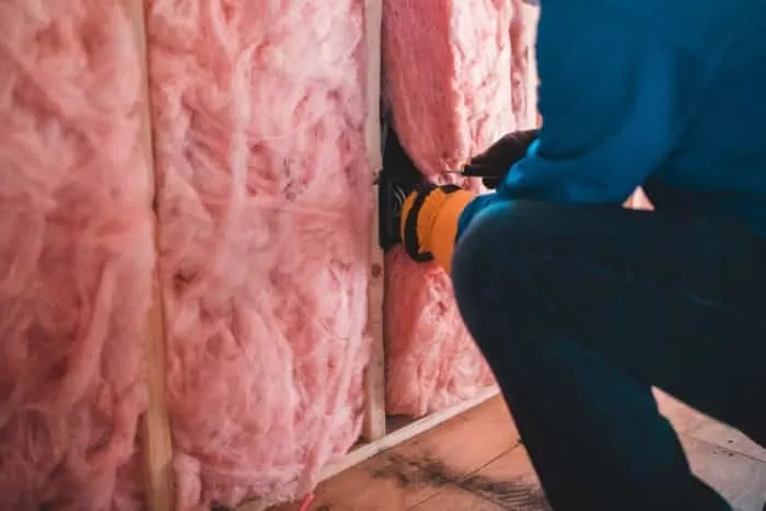 Man Adding an Insulation