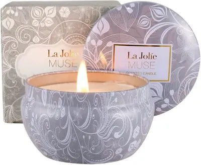 13 Best Sustainable Candles To Buy Today 13 Lit Candle in a Colorful Jar