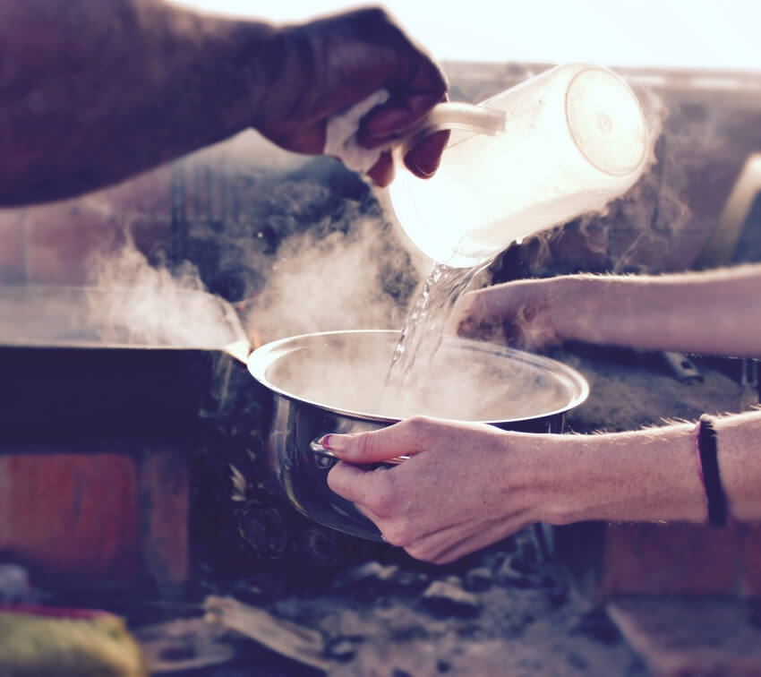 Pouring Hot Water on a Pot