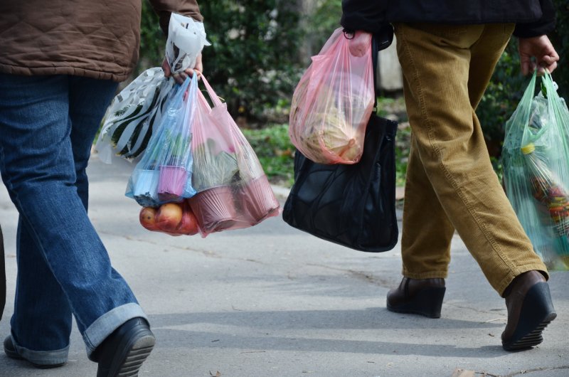 People carrying plastic bag for shopping