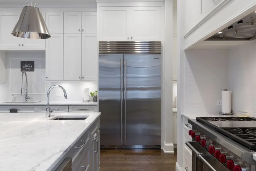 Refrigerator in a Clean and Empty Kitchen