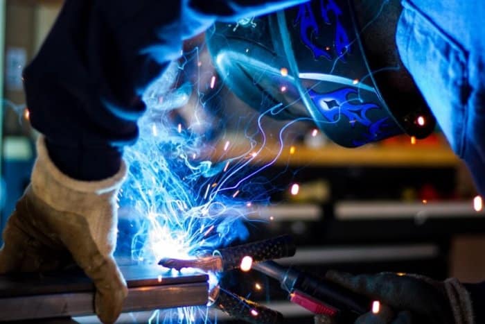 Man Welding a Steel