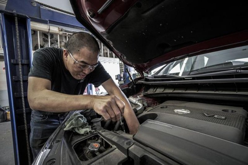 Man Repairing a Car