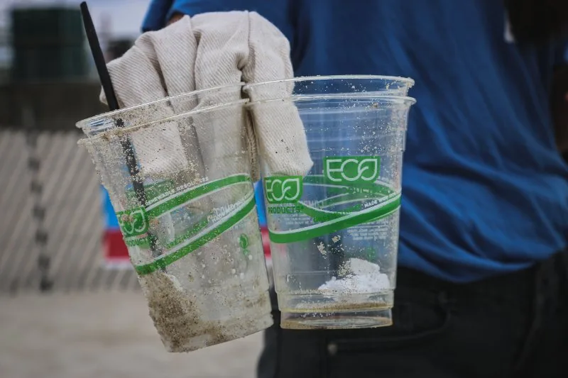 What is Green Washing? Exposing the Green Sheen 4 Holding Plastic Cups