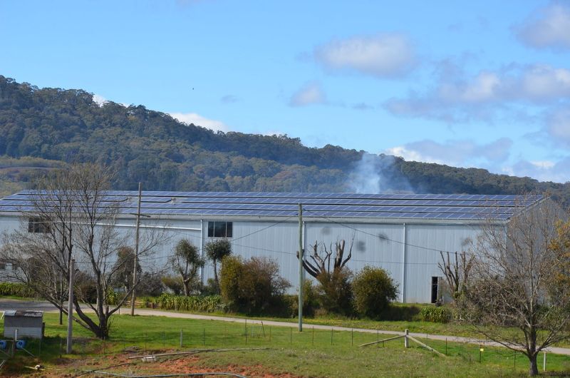 Image of sets of solar panels on a shed.