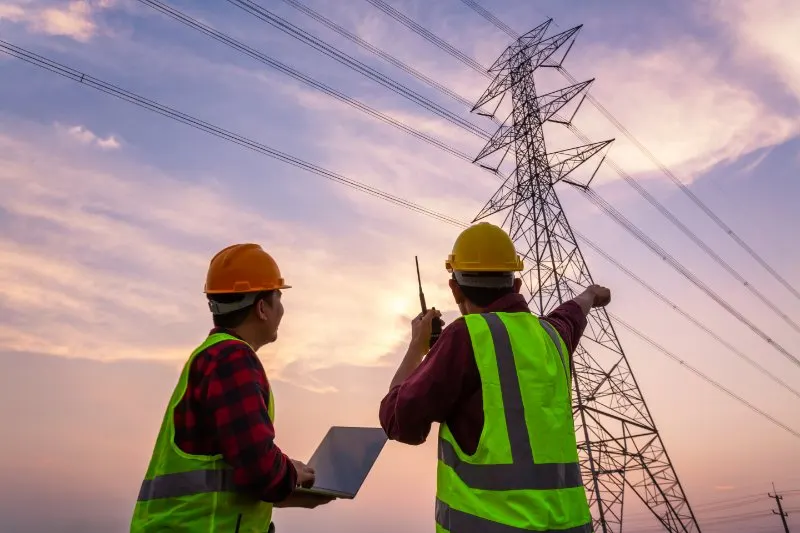 Engineer Inspecting Power Lines