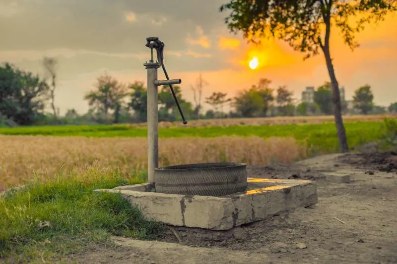 A hand water pump by the road side