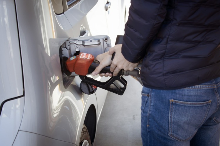 Man fueling his car