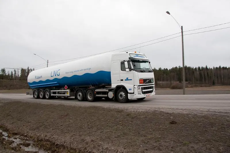 Blue and white trailer truck on a road