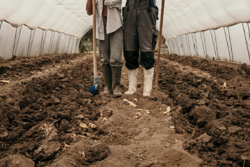 Focus on  legs wearing working boots and working tools