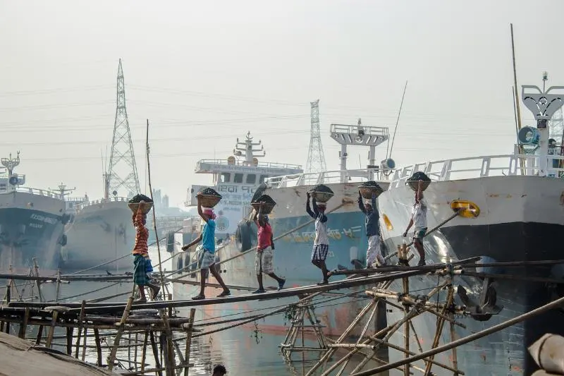 Coal Workers carrying coal on top of their heads