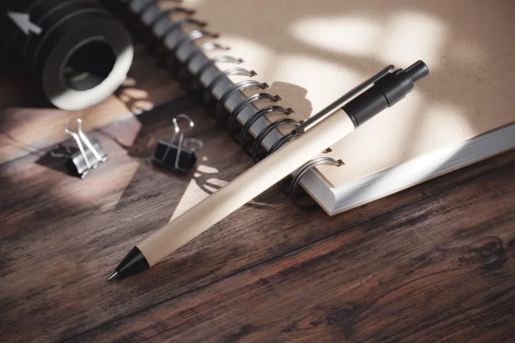 Eco friendly pen on the kraft spiral notebook