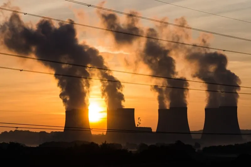 12 Best Solutions to Climate Change 1 Power Plant with smoke on a sunset