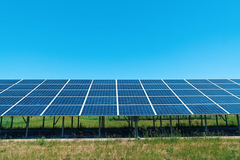 Wide Solar Energy Panels in the Sun and a blue sky