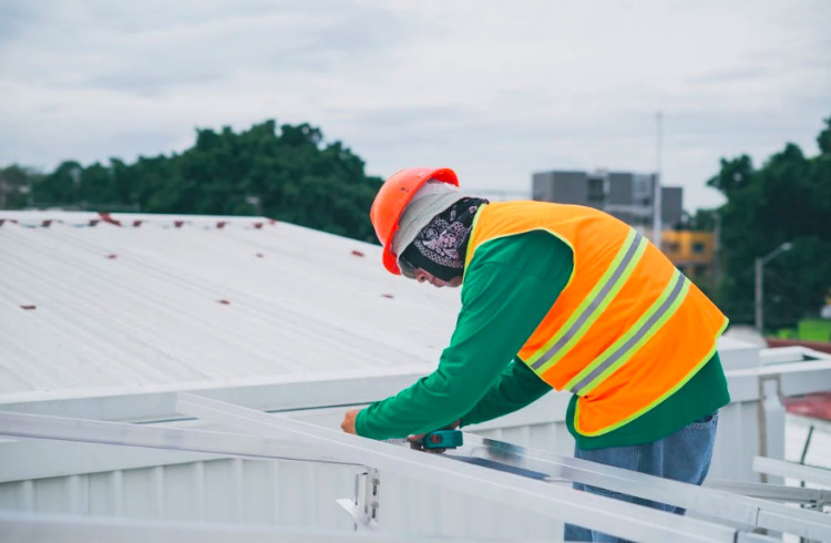 man installing roof