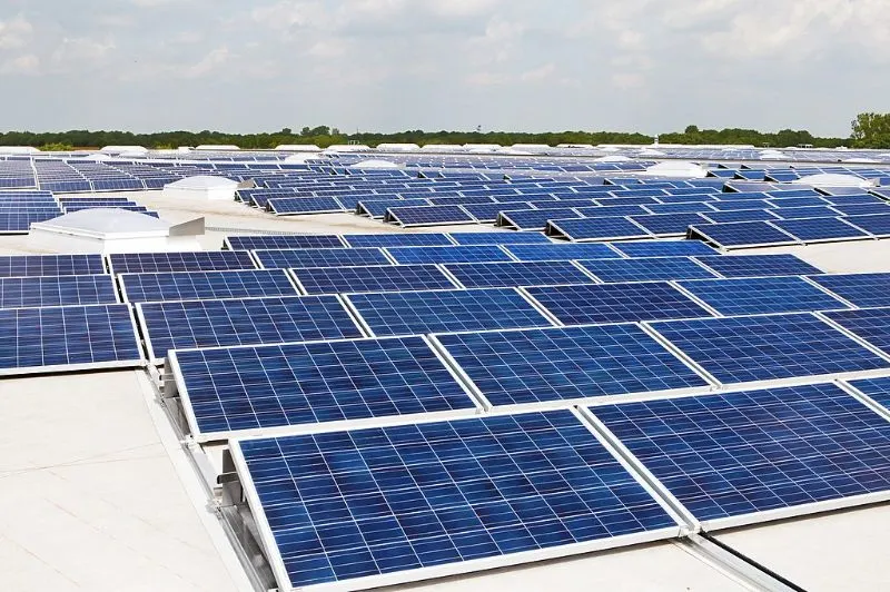 A large white rooftop covered in solar panels