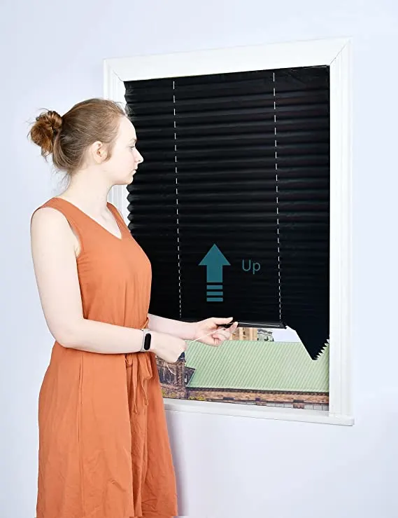 Black blinds woman pulling up black blinds