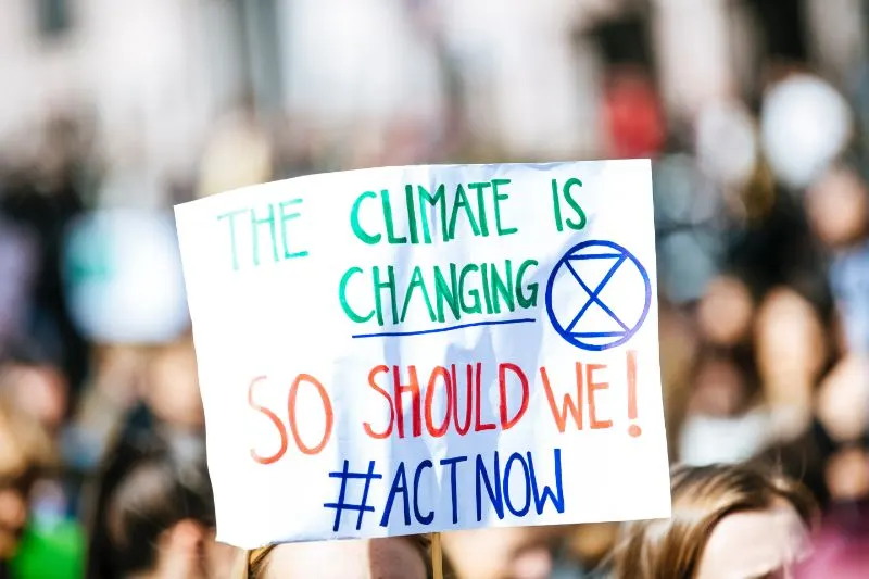 climate change banner in a crowd of people