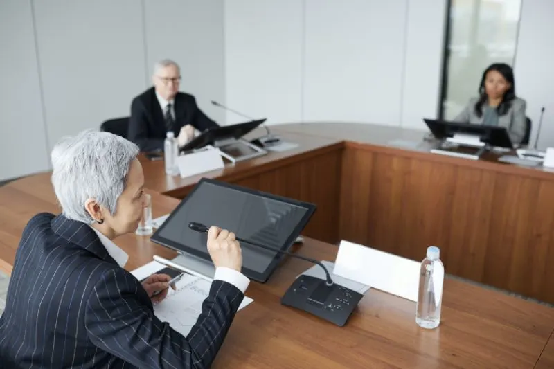 The Environmental Impact of Plastic Pollution: Is It Too Late to Solve? 10 government executives at conference in boardroom