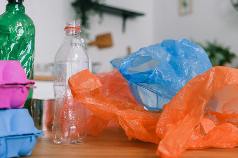 plastic bags and bottles on a wooden desk