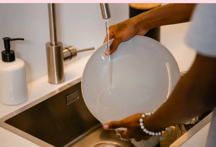 washing dishes in the sink