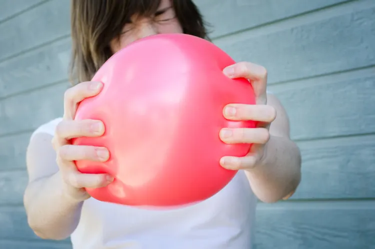 Popping A Balloon Woman Popping A Balloon