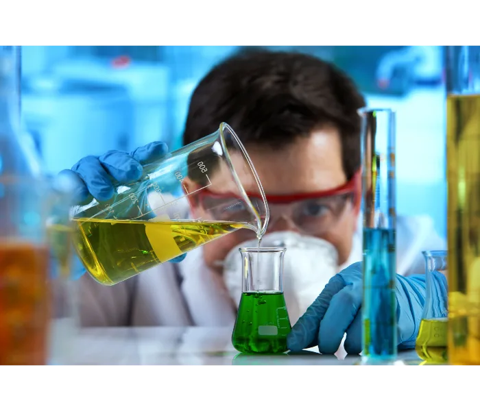 Chemist mixing chemicals Chemist mixing chemicals