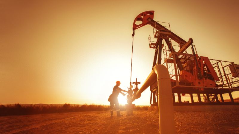 Oil worker is checking the pump 