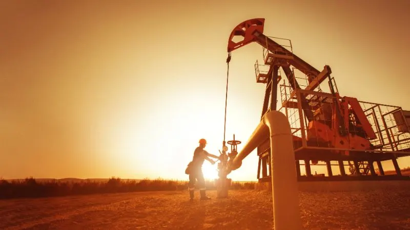 Oil worker is checking the pump 