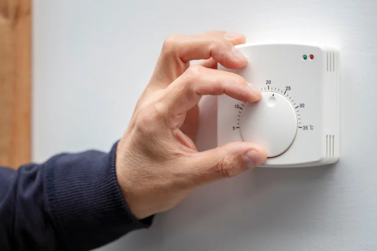 15 Eco-Friendly Tips for Sustainable Living 3 Central Heating thermostat control adjustment