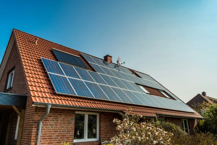 Solar panel on a red roof 