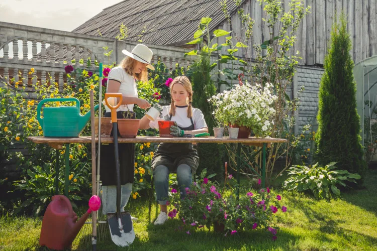 Girls working on home garden