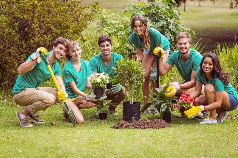 Happy friends gardening for the community